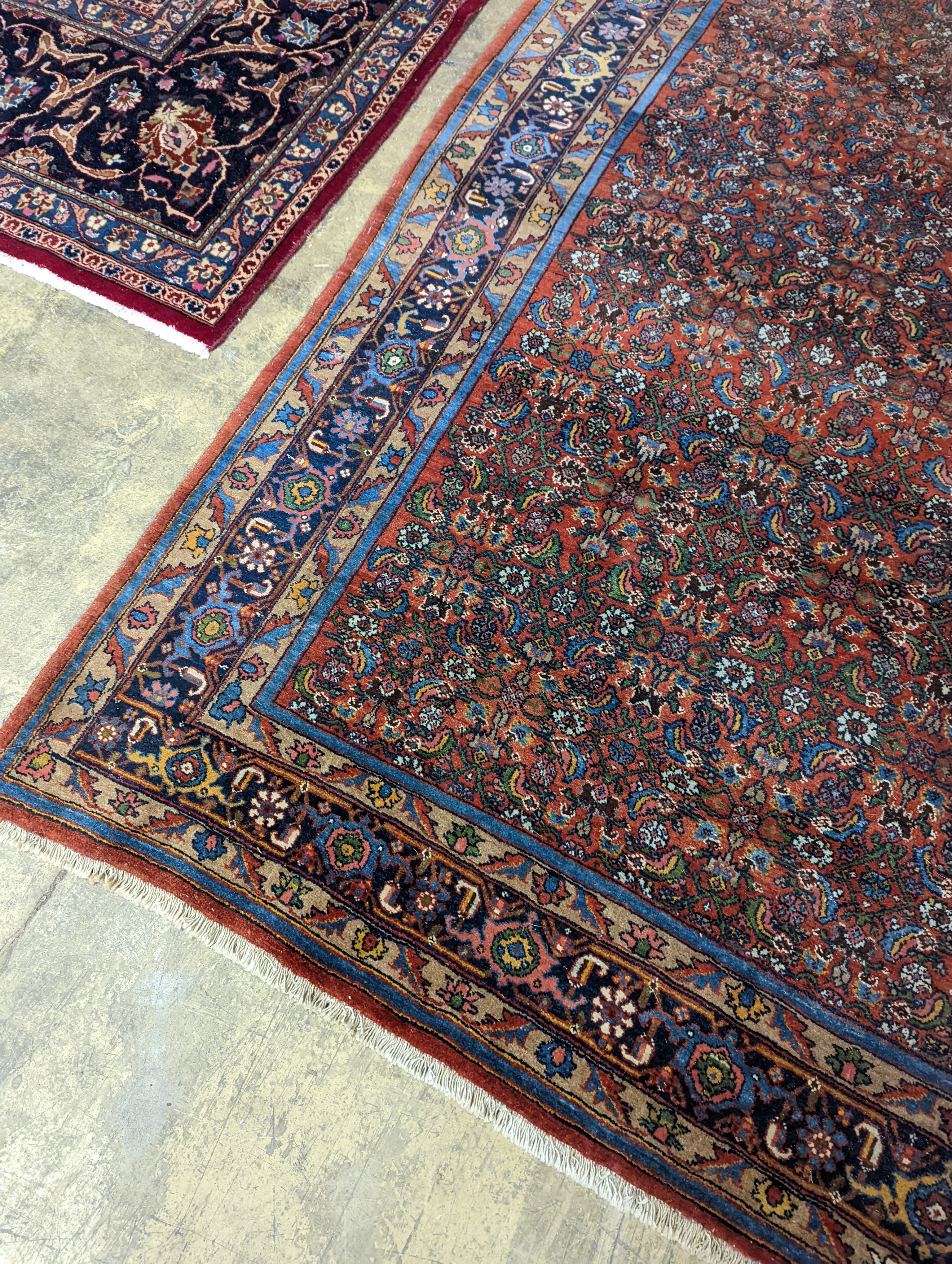 A North West Persian red ground carpet, 360 x 250cm